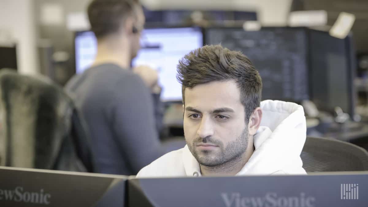 People at work on the brokerage floor at Redwood Logistics.