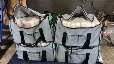 Four duffle bags filled with cocaine seized from a truck at the Canadian border.
