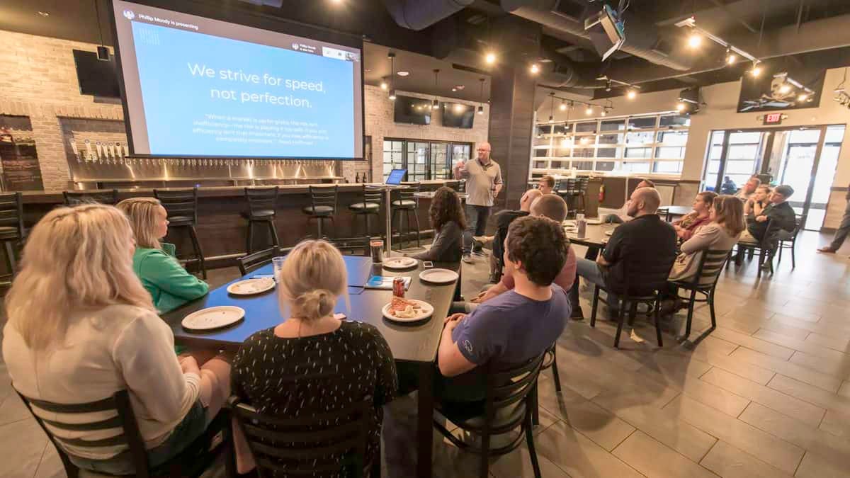 In a pre-COVID photograph, Craig Fuller presents to new FreightWaves employees in the company's Freight Alley.
(Photo: FreightWaves staff)