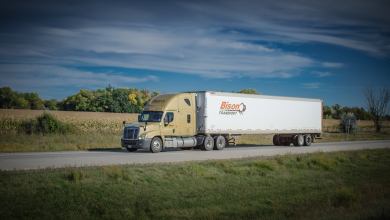 A tractor-trailer of Bison Transport on a highway.