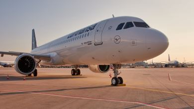Close up front view of a white Lufthansa jet.