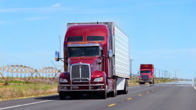 red and white truck on highway