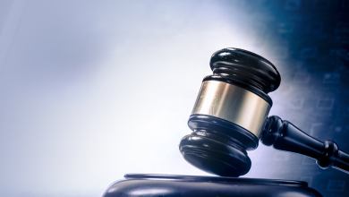 A gavel being struck illustrate a court ruling.