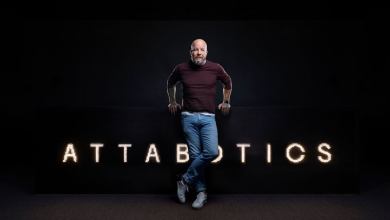 Attabotics CEO Scott Gravelle standing in front of company logo