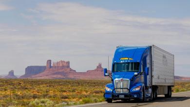 A Prime Inc. semitruck on a highway in the Mountain West region of the U.S.