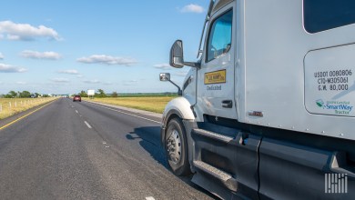 A white JB Hunt dedicated tractor on a highway