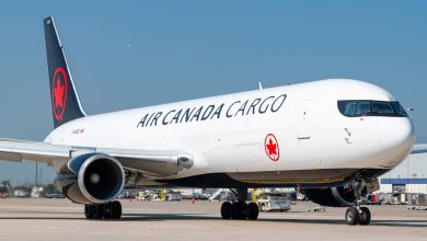 An Air Canada Cargo jet with black/red tail, facing toward the camera at an angle.