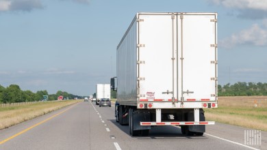a rearview of tractor-trailers on a highway