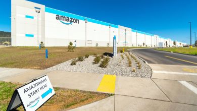 Backside of an Amazon warehouse with name on the side.