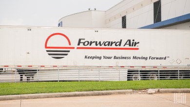 FWRD - a sideview of a Forward Air trailer at a United Airlines facility