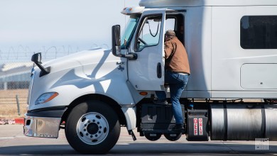 truck driver getting into truck
