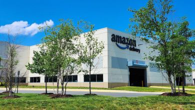An Amazon logistics center with blue logo.