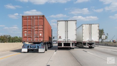 A rear view of trailers on a highway