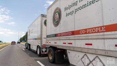 Two Old Dominion pup trailers being pulled on a highway