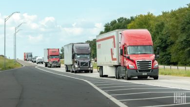 Line of semi-trucks on a U.S. interstate highway, illustrating tightening freight market capacity and rising truckload rates in Q4 2025 according to U.S. Bank Freight Payment Index data