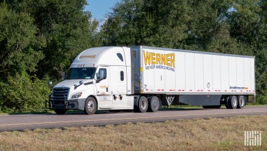 a white Werner sleeper cab pulling a white Werner trailer
