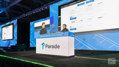 Parade podium and large screens displaying the company’s AI capacity management platform at “The Future of Supply Chain” conference stage