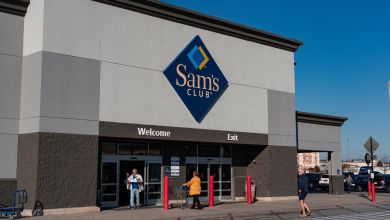 Front view of a Sam's Club outlet on a sunny day.