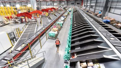 Massive conveyor systems with dividers as seen in a large postal facility.