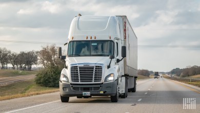 a closeup of a tractor-trailer on a highway