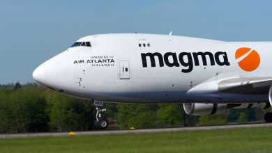 Close front view of a Boeing 747 jumbo cargo jet with Magma logo.