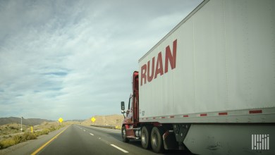 a Ruan trailer being pulled on a highway