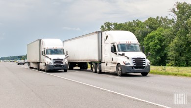two unidentified tractor-trailers on a highway