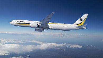 A computer-generated image of an MSC Air Cargo jet with yellow accents flying above the clouds.