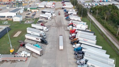 Aerial view of a crowded truck terminal packed with semi-trucks and trailers as truck capacity tightens and shipper freight costs rise
